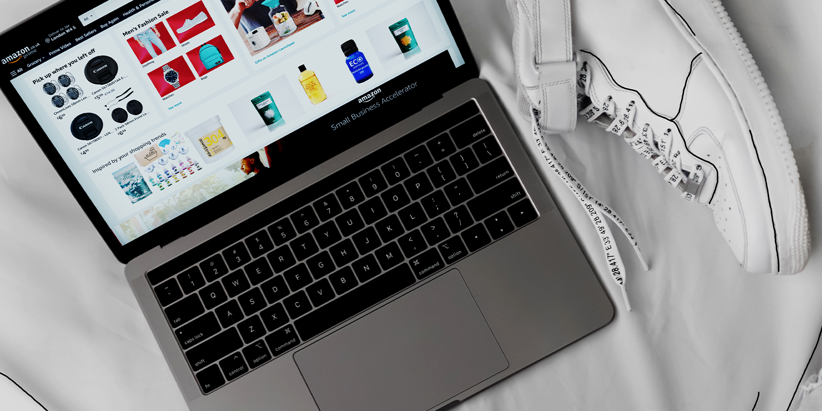 Mac laptop, someone scrolling on Amazon, ready to sell new products D2C